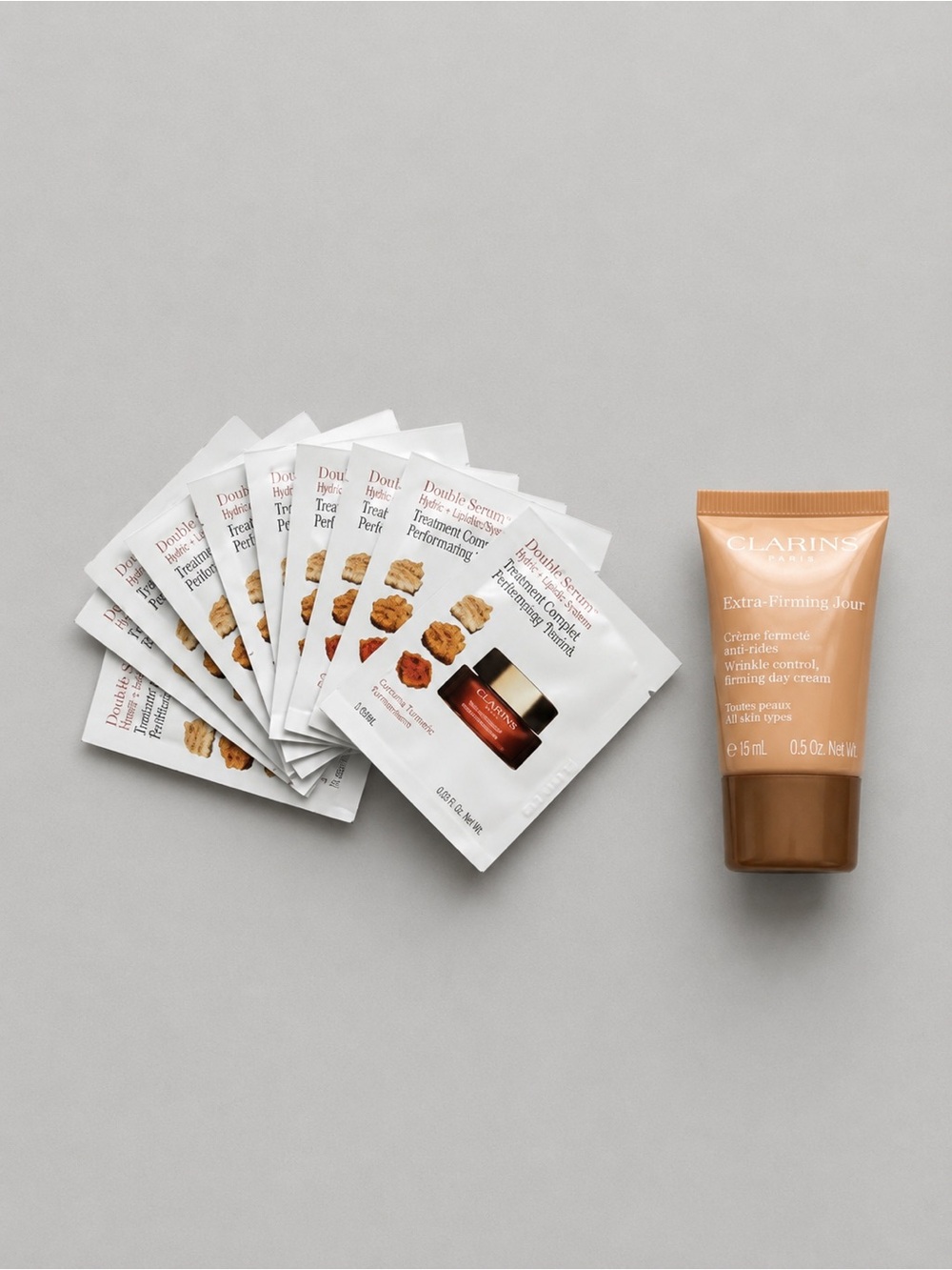Clarins bundle with firming day cream 15ml and 10 sachets of moisturizer
